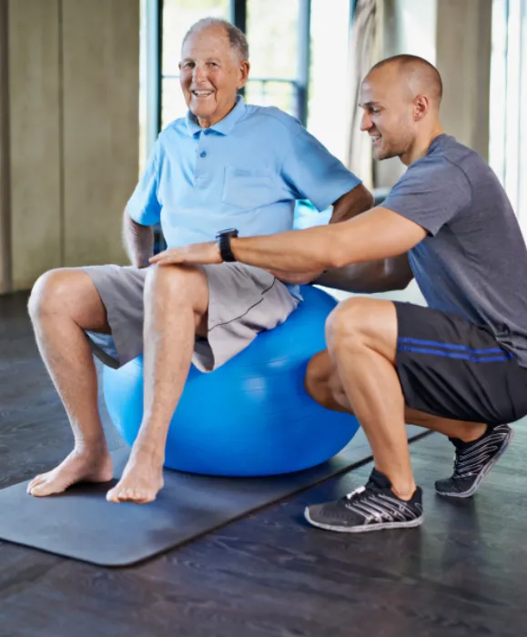 Our Locations CIP Rehabilitation Inc. Banner Image Physiotherapist, support and senior man with ball, training and elderly help for care. Men, gym and exercise for health, wellness and coaching with osteoporosis for mature rehab and wellbeing